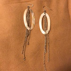 White oval earrings with hanging chains